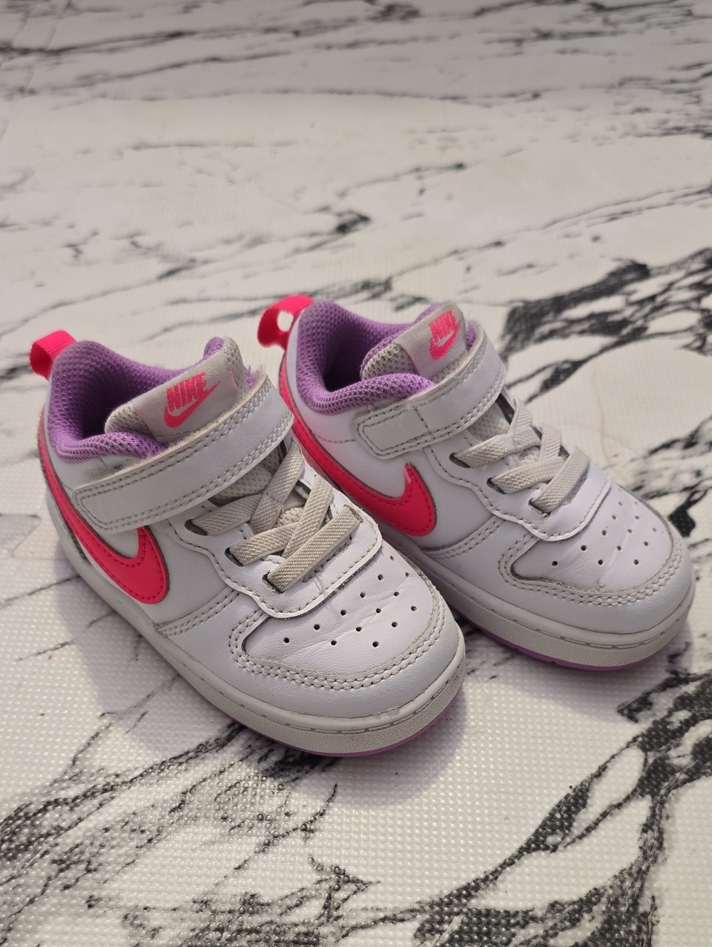 Nike Kids White Sneakers with Pink Swoosh and Purple Lining